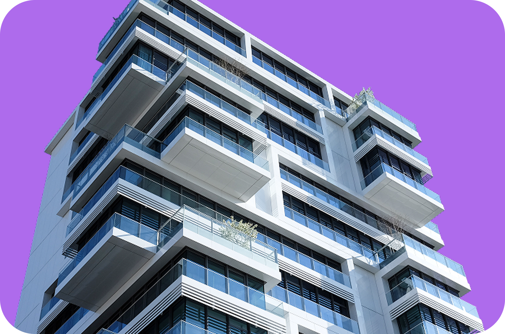 Modern white apartment building with multiple glass balconies against a purple background.